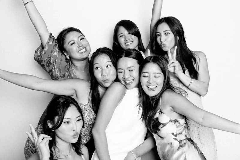 Bridesmaids striking poses in black and white