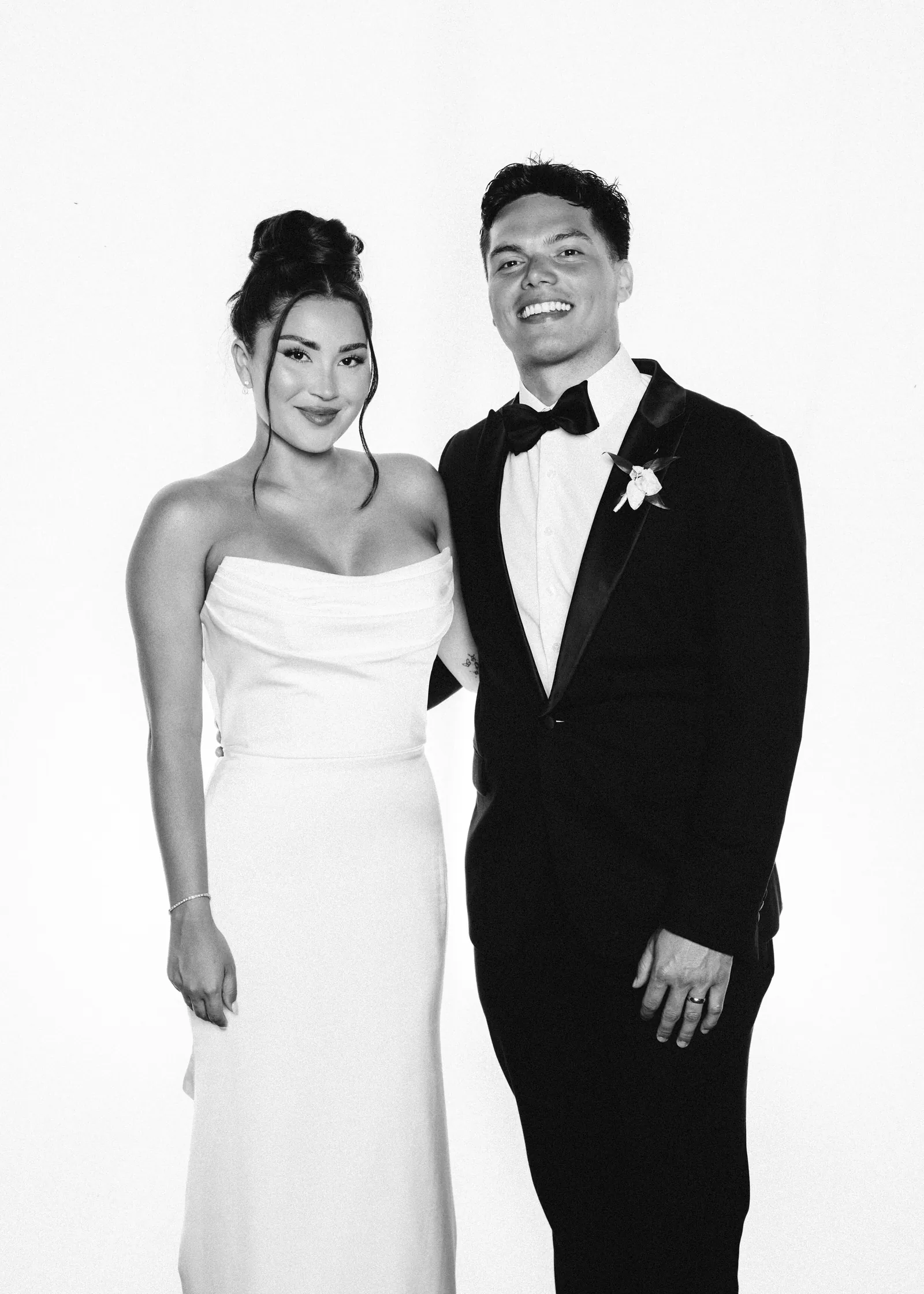 Bride and groom posing in the Photo Lounge studio, black and white