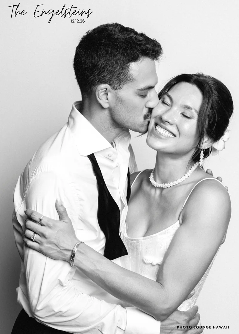 Black and white 5x7 print of a couple kissing, with The Engelsteins 12.12.26 layout
